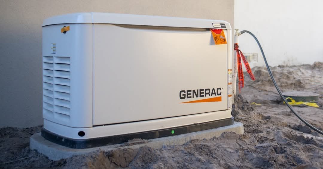 Whole-home standby generator installed beside a Huntsville Alabama home